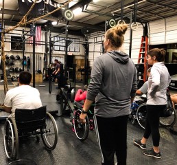 Adaptive Crossfit Members in wheelchairs get ready for a WOD