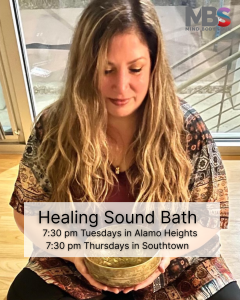 Image of a woman peacefully holding a brass bowl