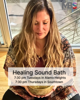 Image of a woman peacefully holding a brass bowl